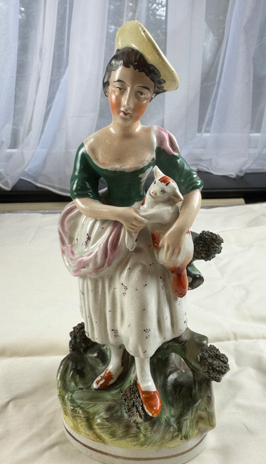 A 19th Century Thomas Parr Staffordshire Figurine of a Woman Holding Her Cat